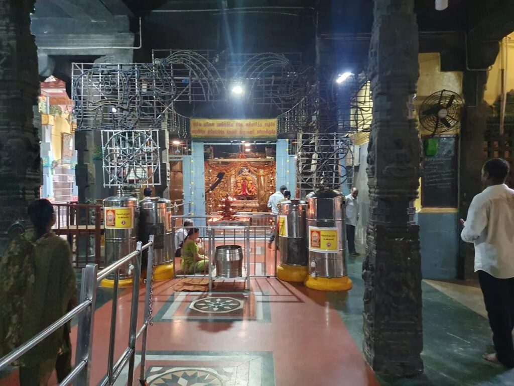 Inner sanctum and deity shrine view at Kalikambal Temple Chennai with brass hundis and steel railings